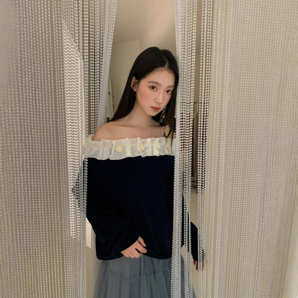 A beautiful lace slanted shoulder open-back knit sweater