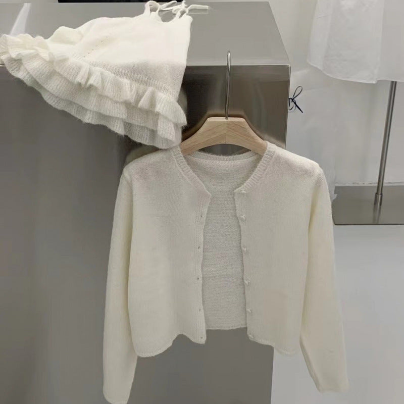 Lotus leaf edge solid color skin-friendly knitted cardigan suspender vest two-piece set