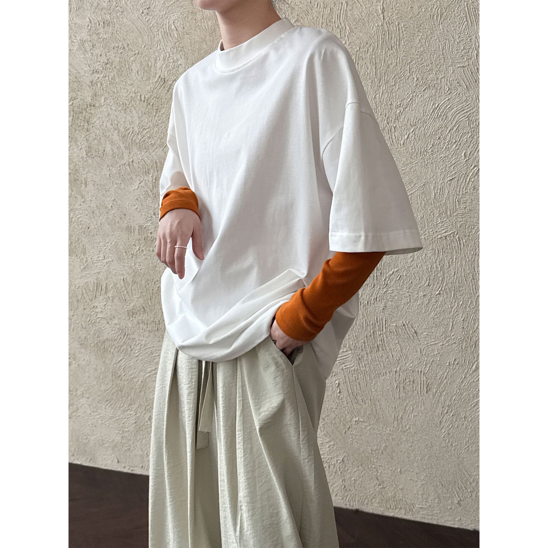 Casual solid color polished loose shoulder short sleeve women's early spring new silhouette simple round neck T-shirt
