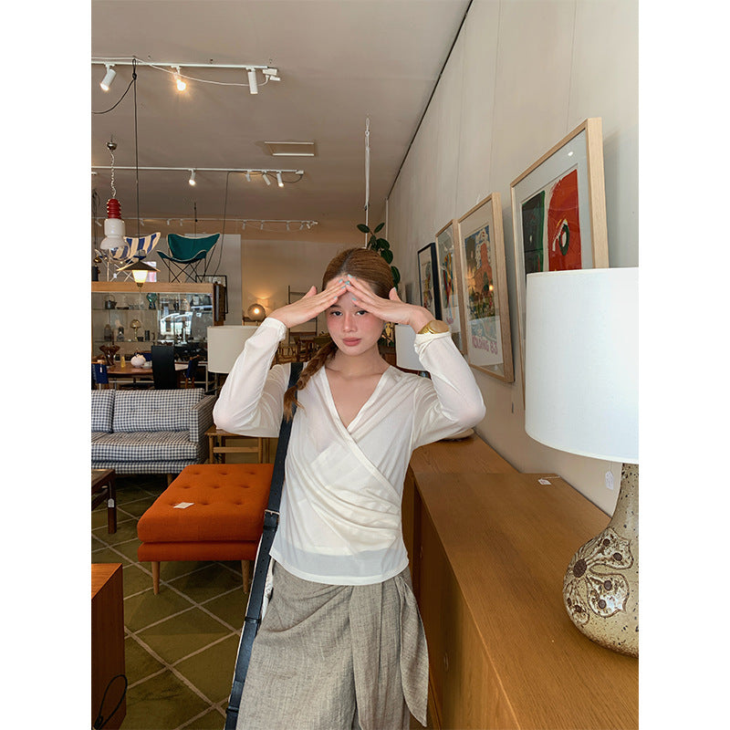 Spring French age-reducing cross V-neck long-sleeved irregular hem bottoming shirt