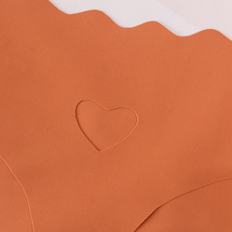 One-piece seamless women's underwear solid color hollowed-out wavy waist low waist nylon sticker underwear