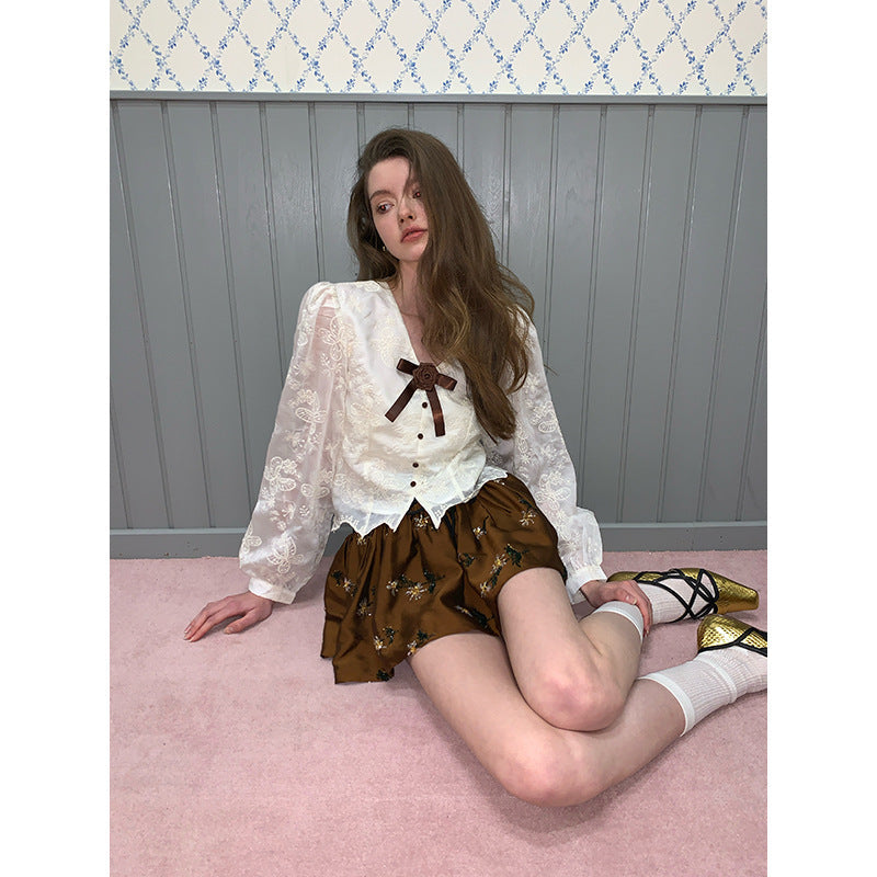 Beautiful age-reducing embroidered bow top