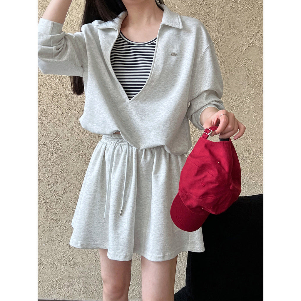 Korean age-reducing suit women's autumn new fake two-piece sweater + elastic skirt two-piece set