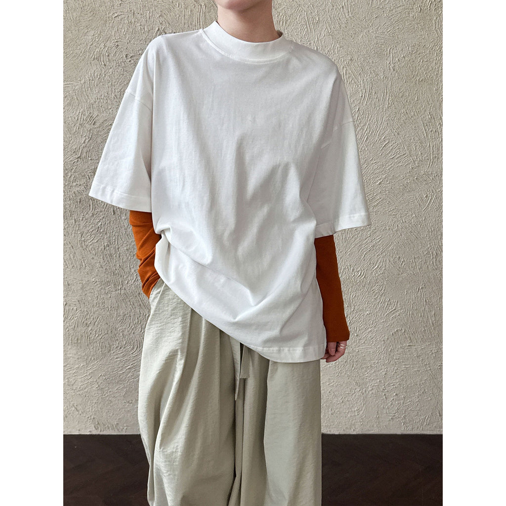 Casual solid color polished loose shoulder short sleeve women's early spring new silhouette simple round neck T-shirt