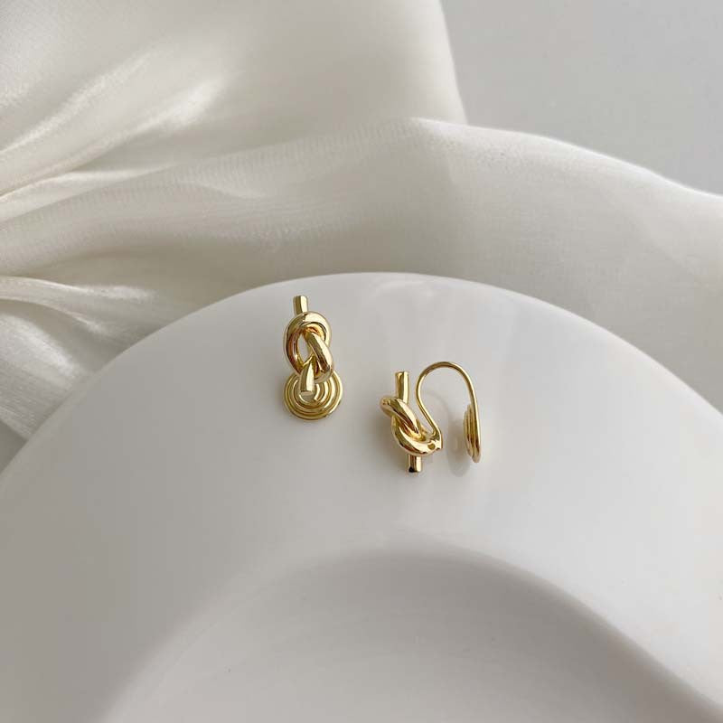Retro simple cold wind earrings knotted mosquito coil disc earclips versatile temperament geometric irregular earrings