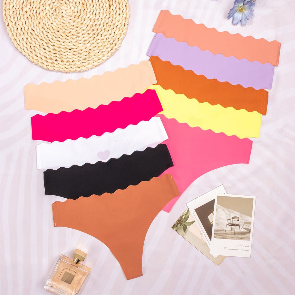 One-piece seamless women's underwear solid color hollowed-out wavy waist low waist nylon sticker underwear