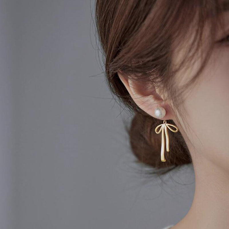 Cold sense pearl bow stud earrings niche light luxury high sense earrings cold wind temperament versatile commuter earrings