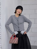 Contrasting buttons fake two-piece cardigan knitted sweater