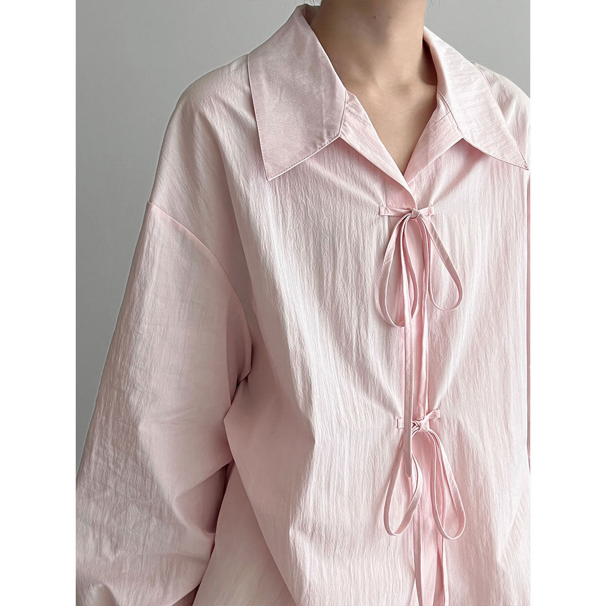 Korean small fresh temperament design sense lace-up shirt women's early autumn new niche loose top