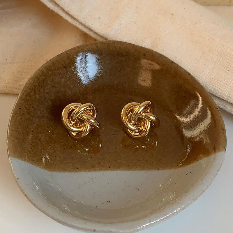 Winding twist Japanese and Korean simple design stud earrings niche versatile hollow earrings metal kink cold wind women's earrings
