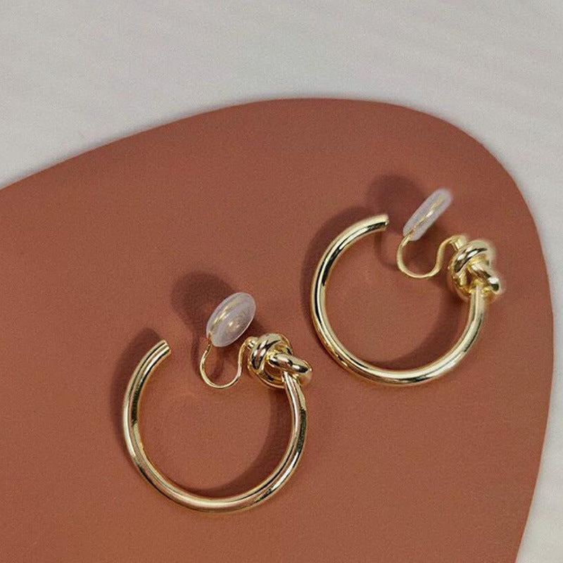 Cold wind knotted large circle without ear holes, mosquito coil disc, ear clips, silver needle, round earrings, Hong Kong style femininity niche earrings