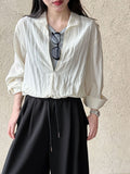 Korean simple fake two lazy style shirts in summer, a new spliced V-neck age-reducing long-sleeved shirt